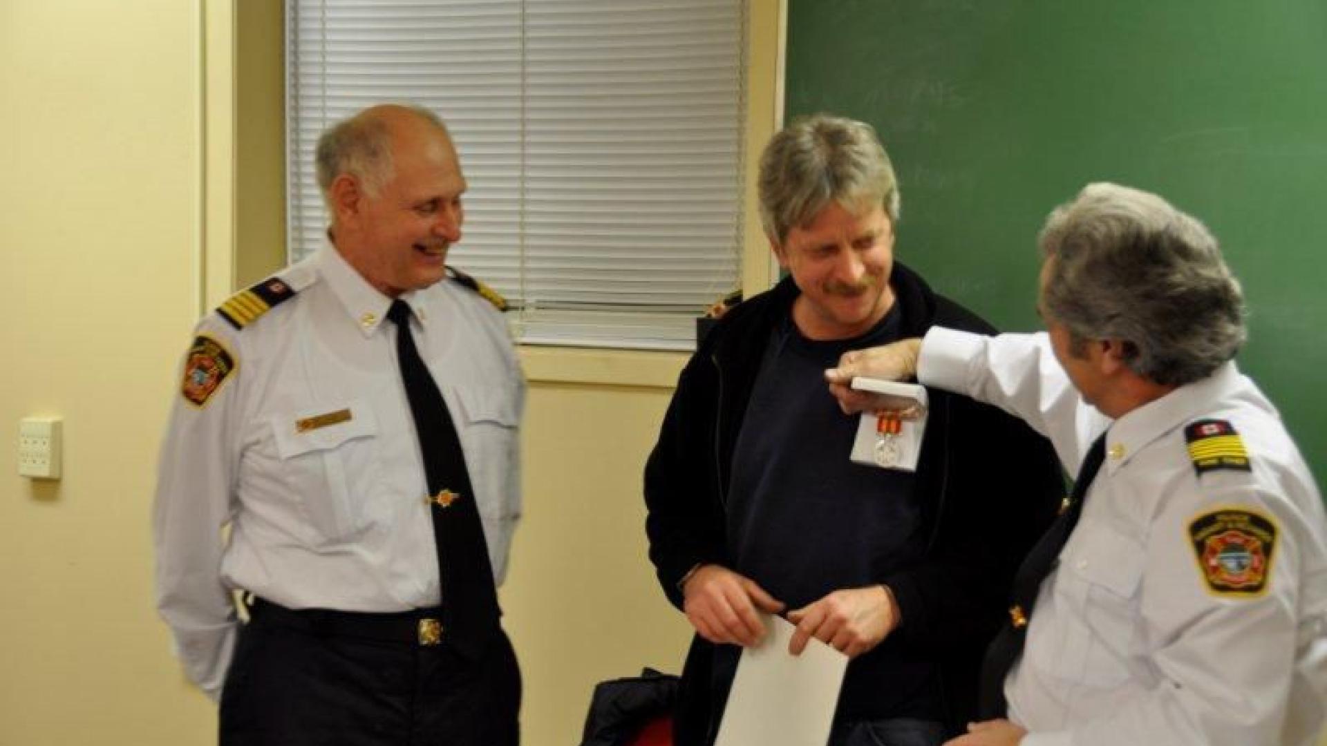 Rick Pecaskie receiving an award at 20th anniversary ceremony