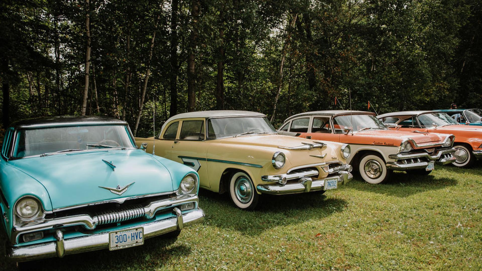 a lineup of four old school muscle car
